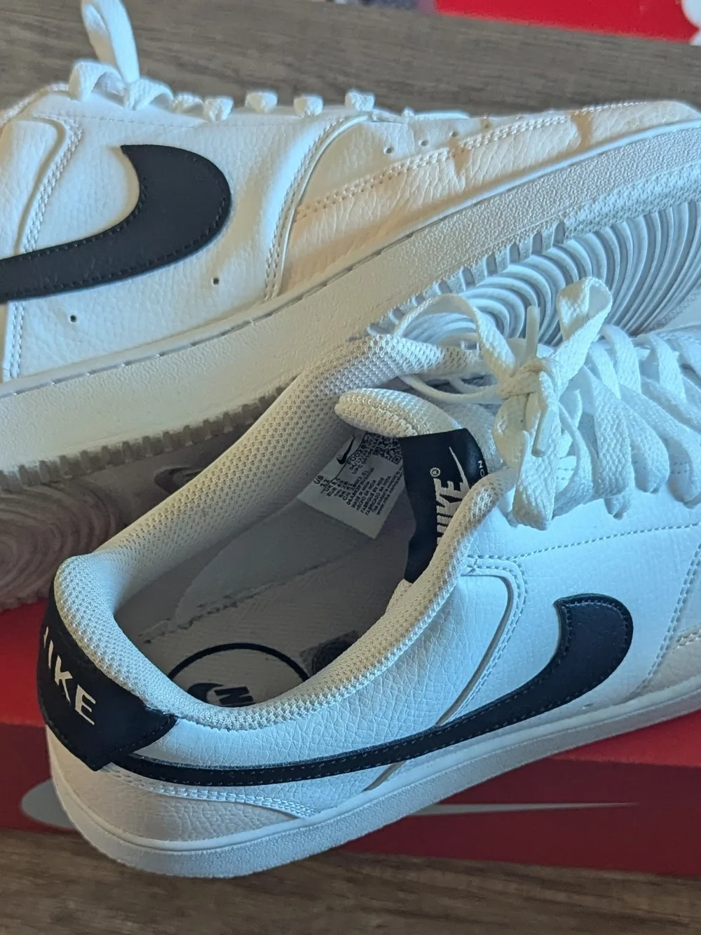 Nike Men’s White Leather Sneakers with Black Swoosh
